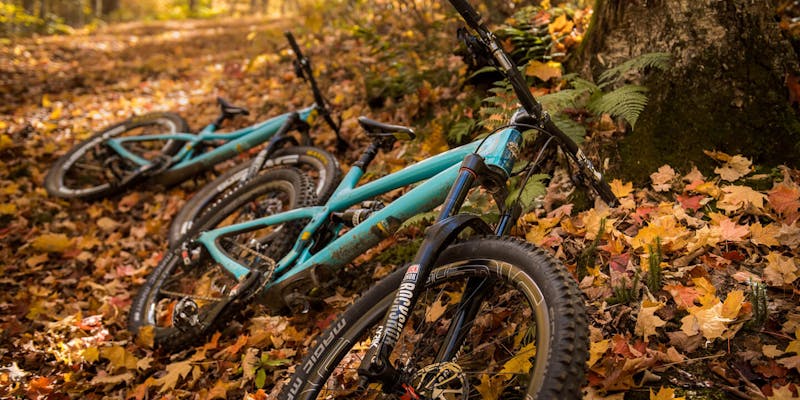 2 Yeti SB5's parked along side the trail.