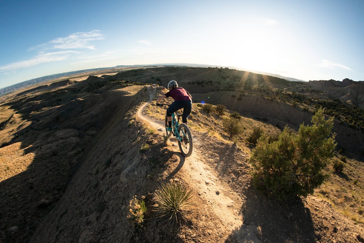 Liz Cunningham riding a ridge in Fruita