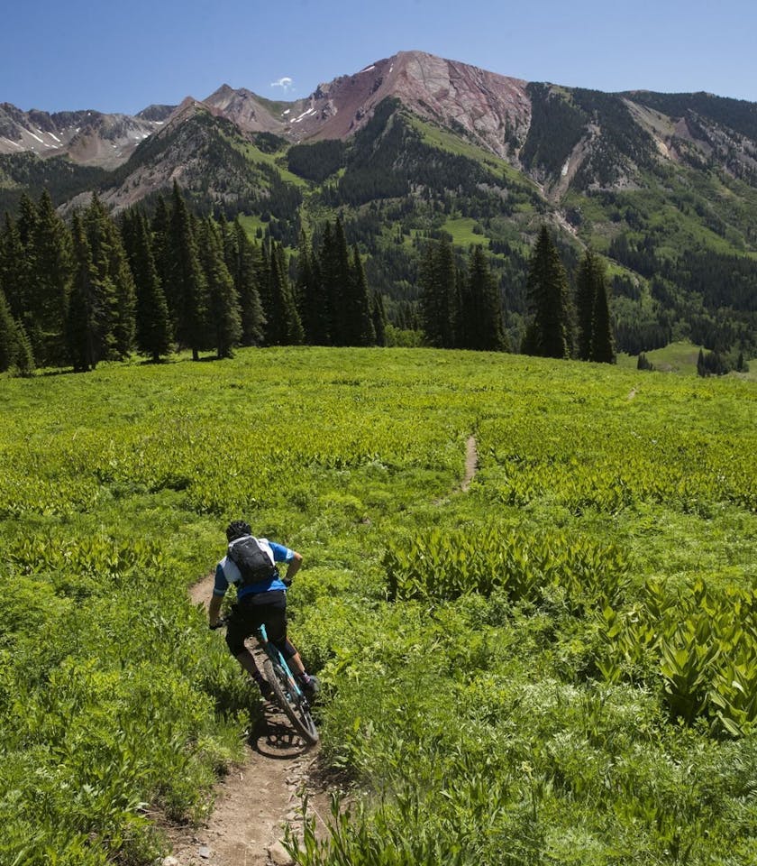 Joe Lawwill descending into a green valley