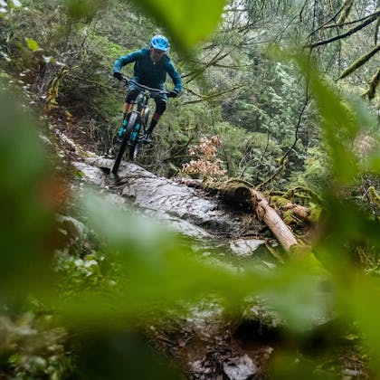 Riding the SB100 over a rock face