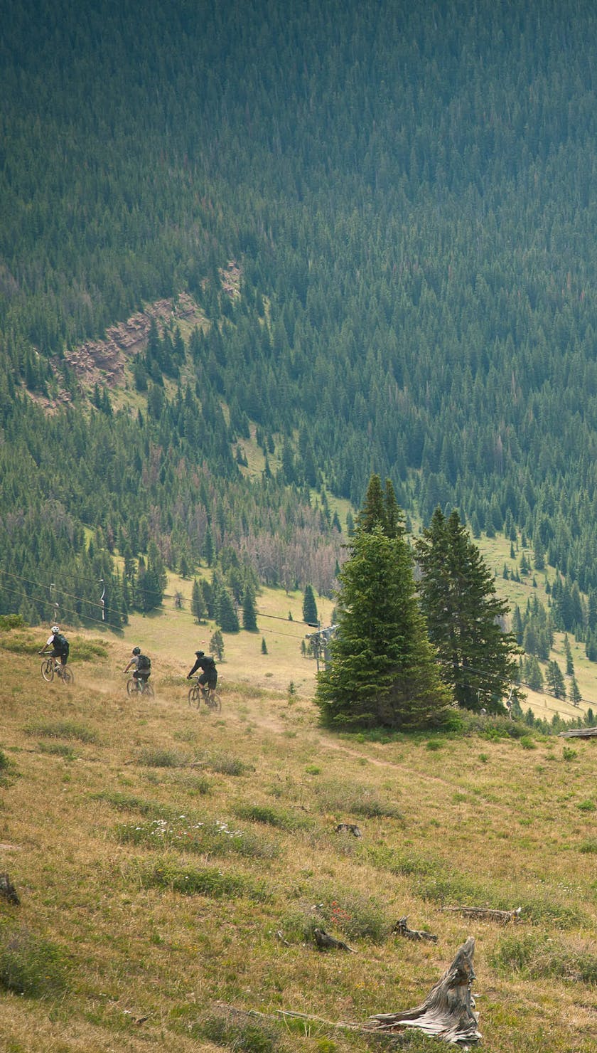 Riders descending into a valley