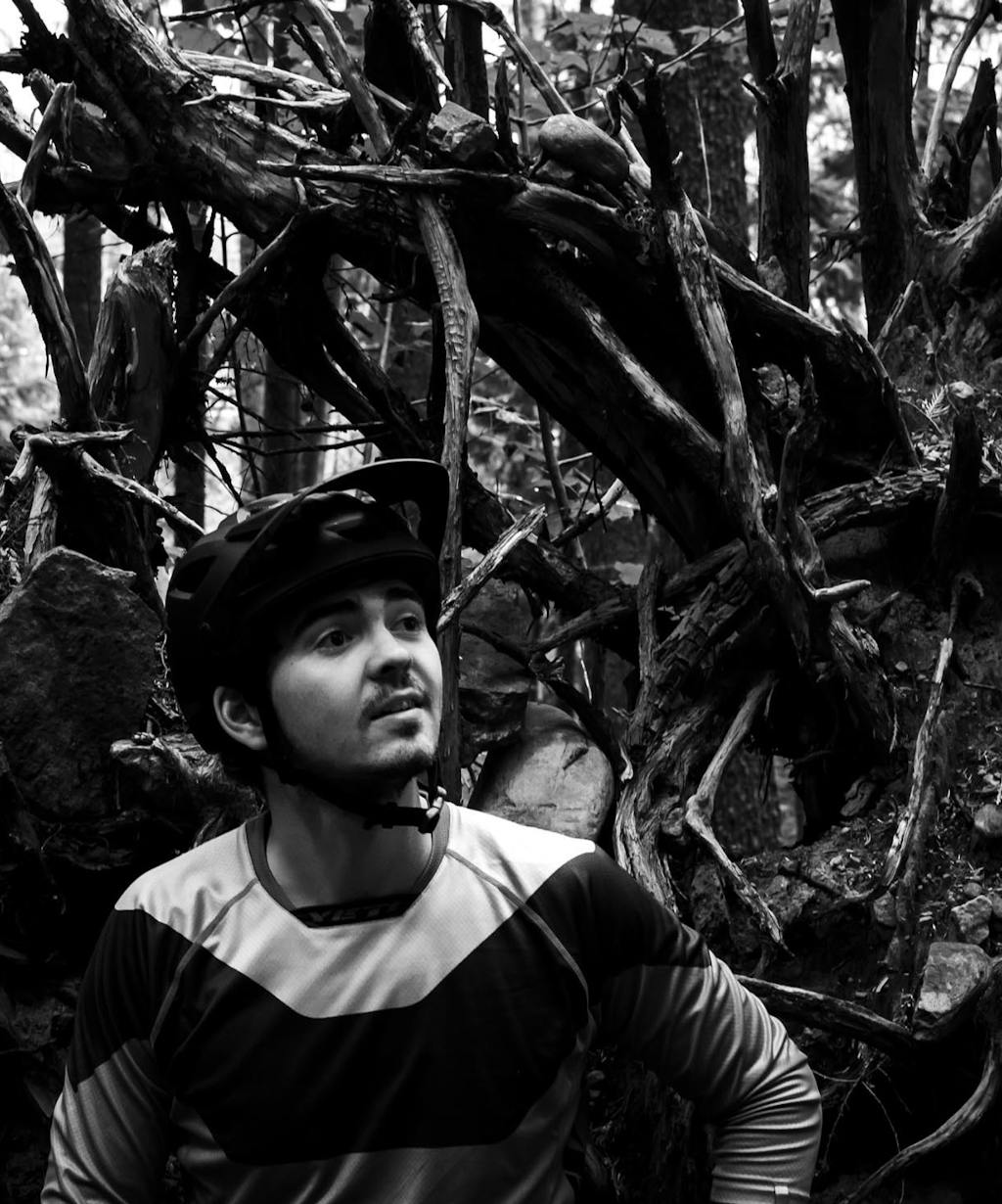 Stu Dickson next to an uprooted tree