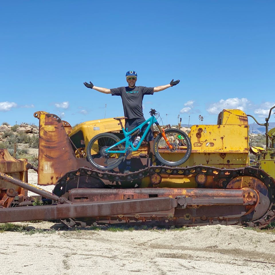 Joe Lawwill posing on heavy machinery