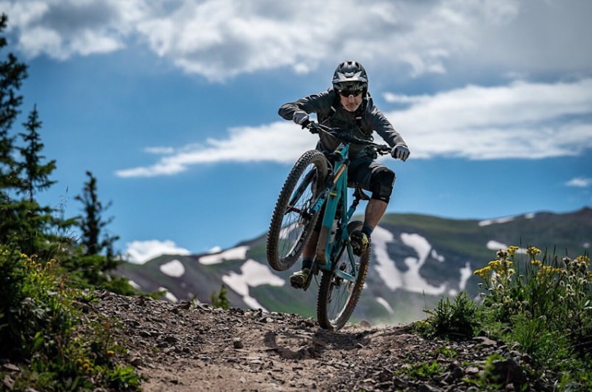 Mike West doing a power wheelie in the high country