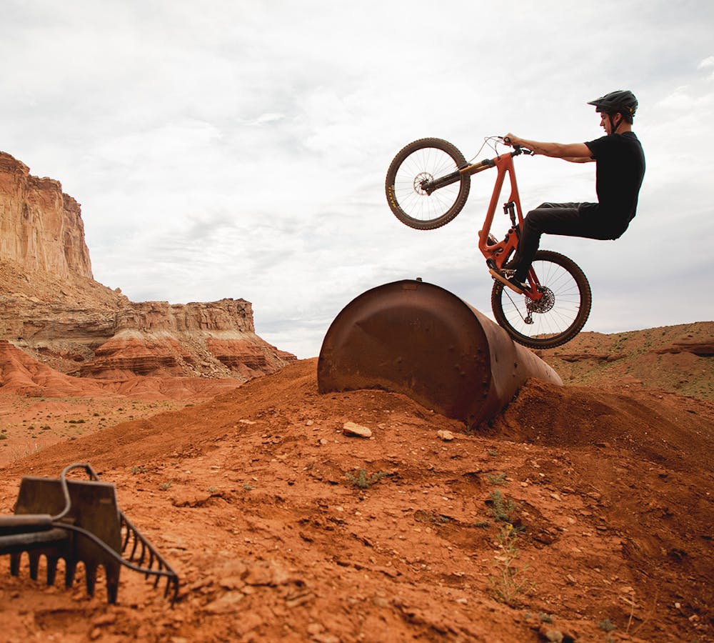 male rider jumping with a yeti sb140