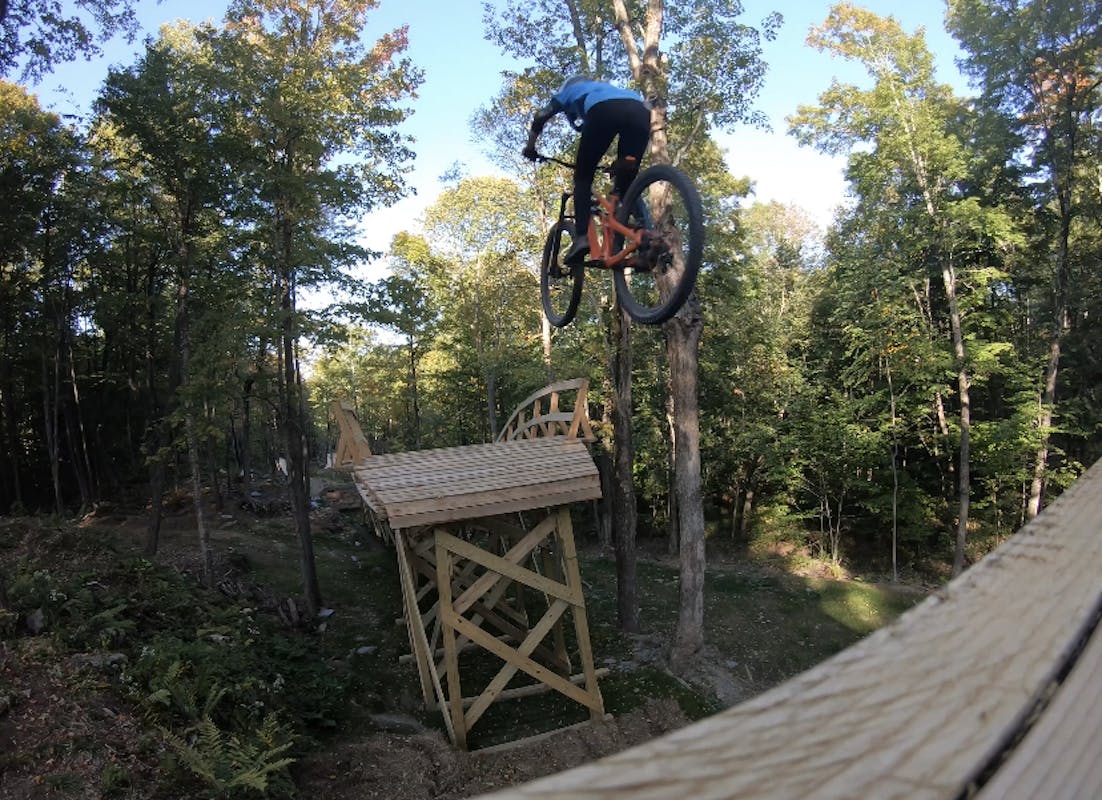 Laura Slavin gapping to a wooden bridge