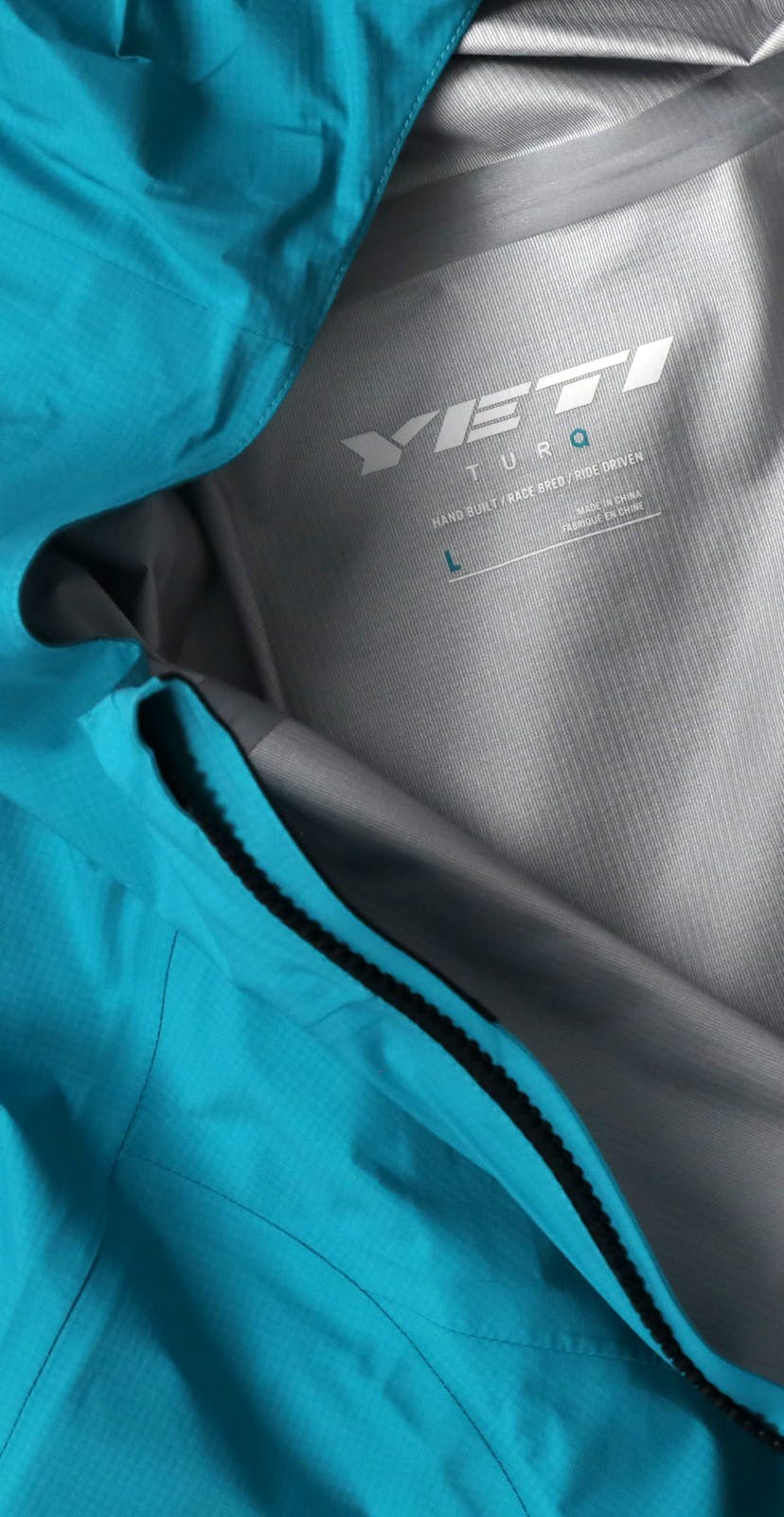 Turq Commit Jacket Detail