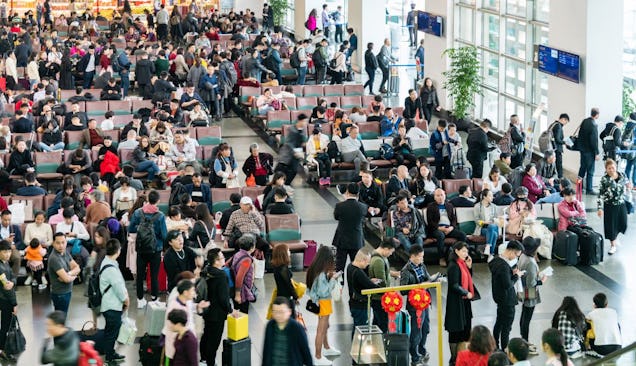 The picture shows a crowded airport