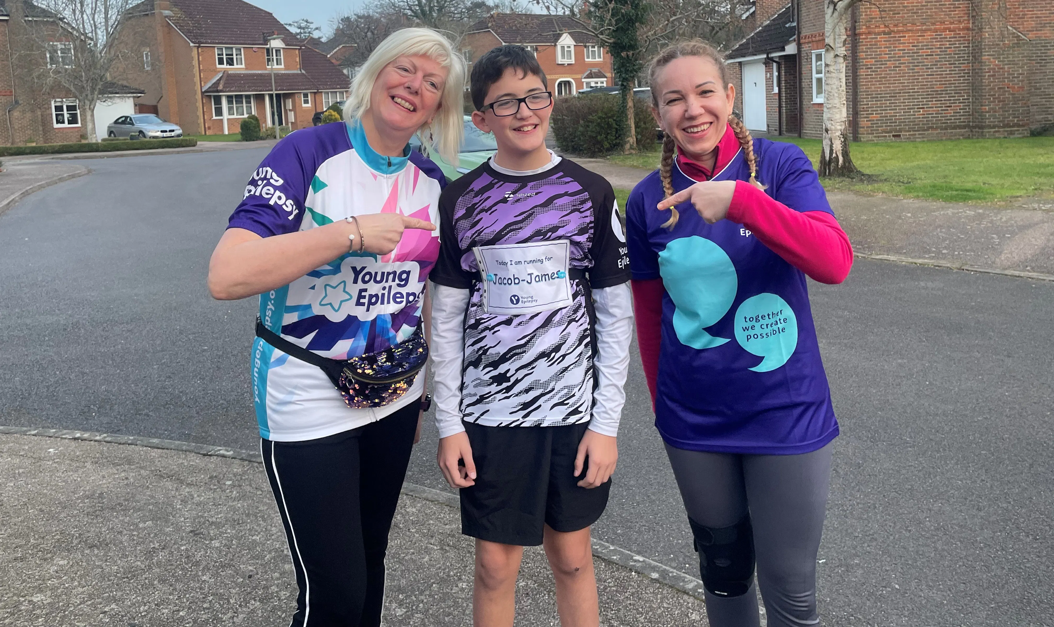 Zac, Lorraine and another friend smiling in their Young Epilepsy marathon tops.