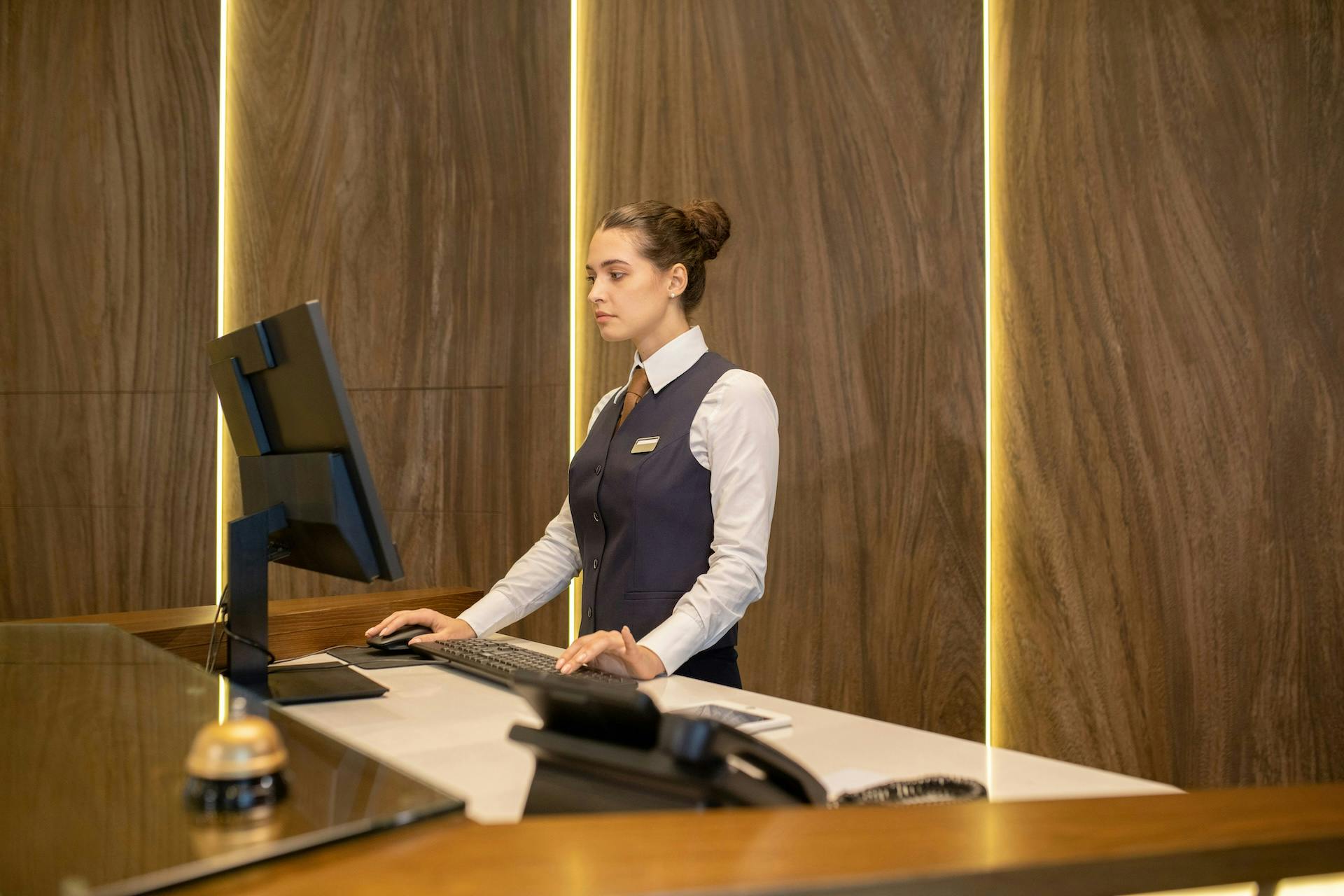Hotel receptionists looking at the screen