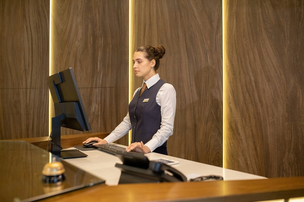 Hotel receptionists looking at the screen