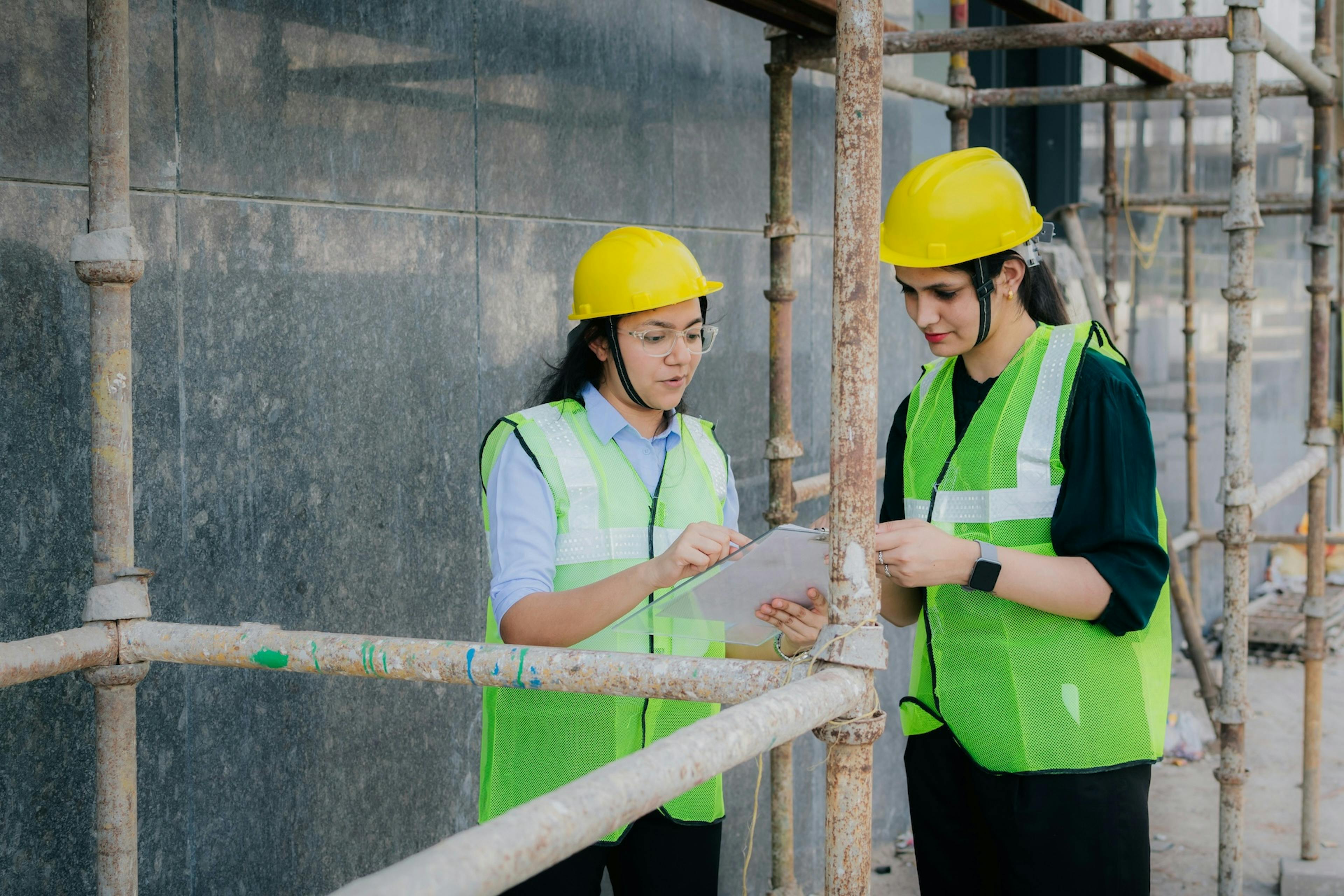 two workers looking at the file