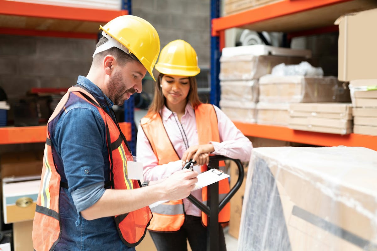 two workers in the warehouse