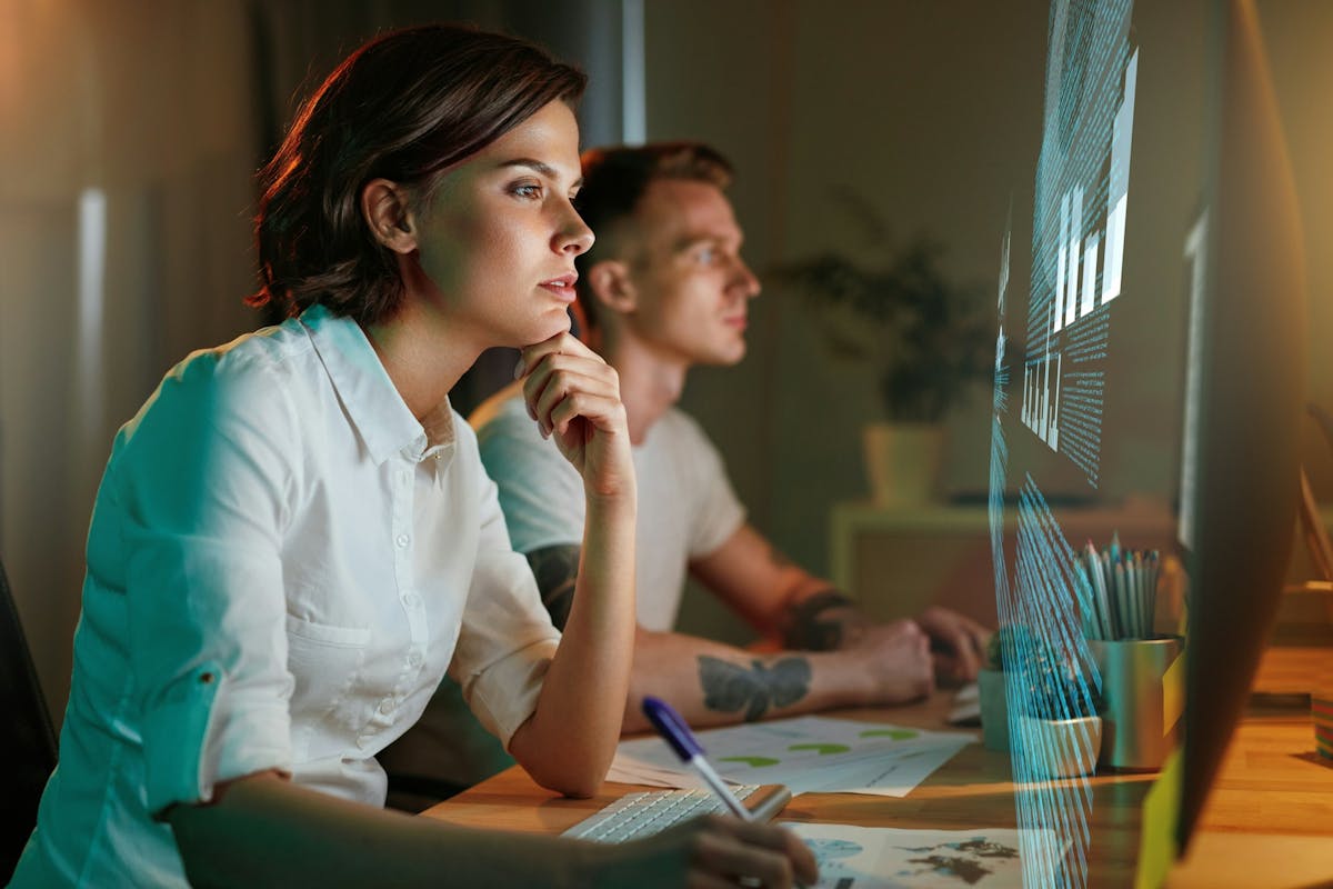 people looking at a holographic screen