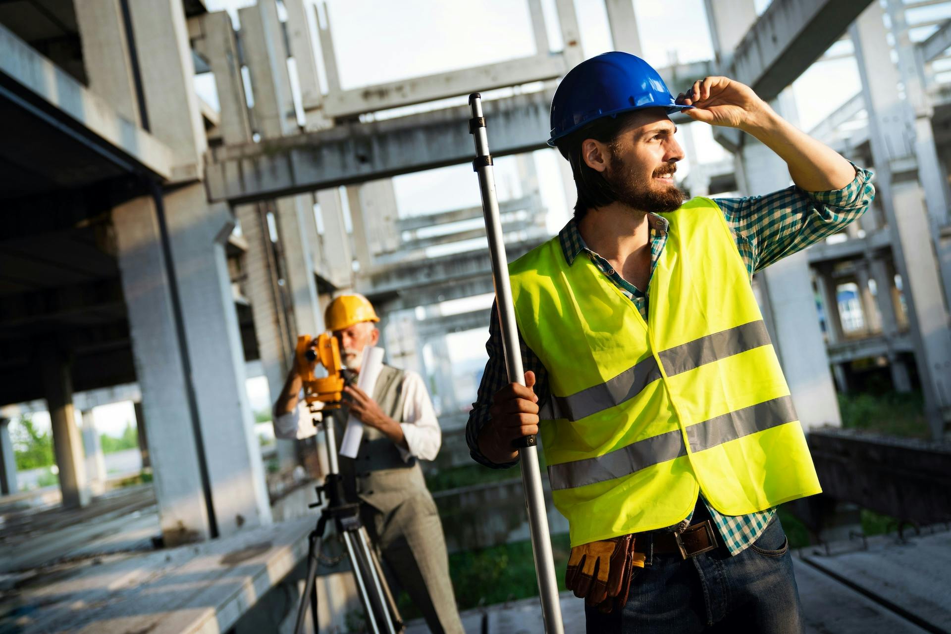 Two construction professionals working at an active build site