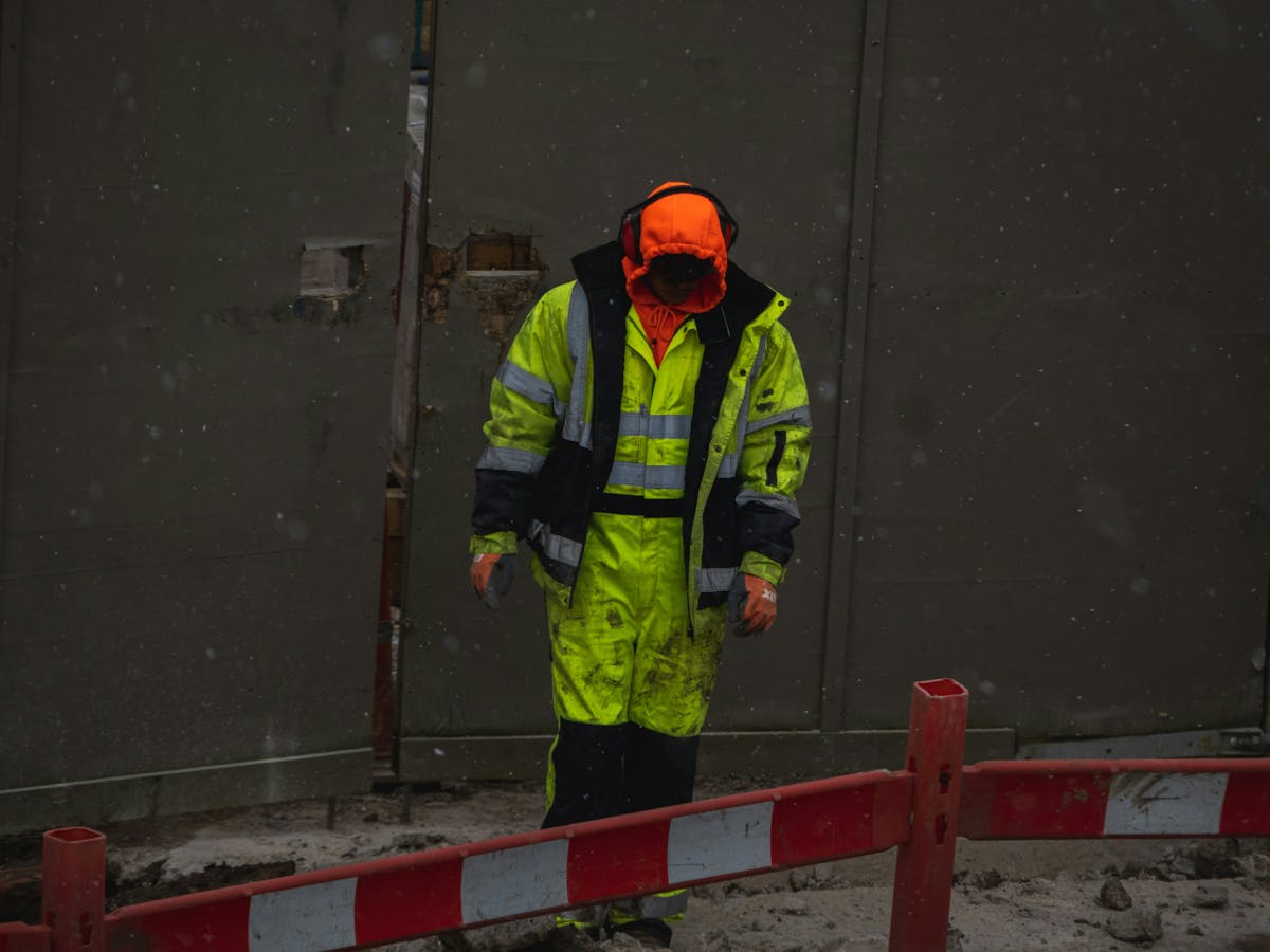 Worker on job site in severe weather