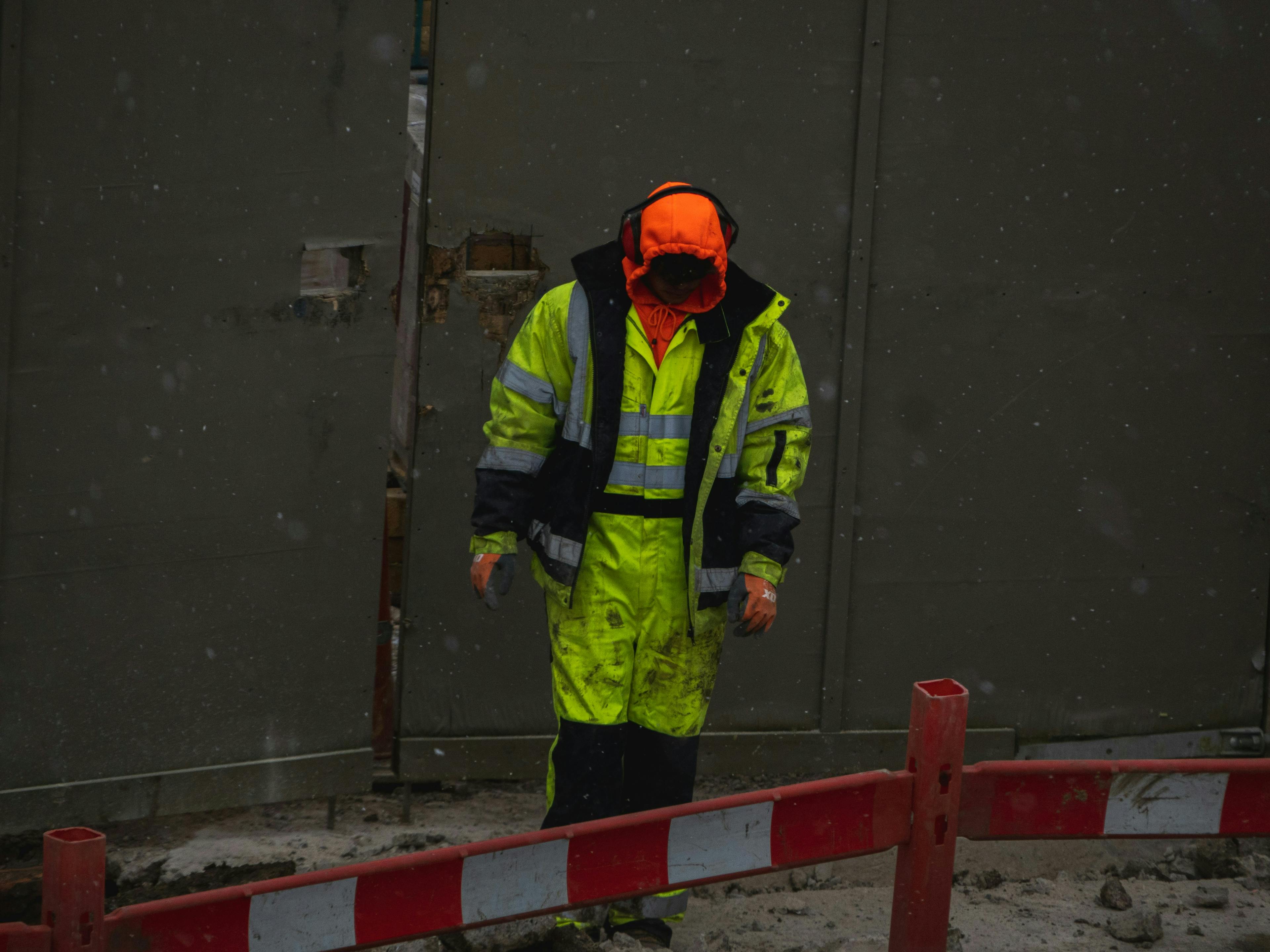 Worker on job site in severe weather