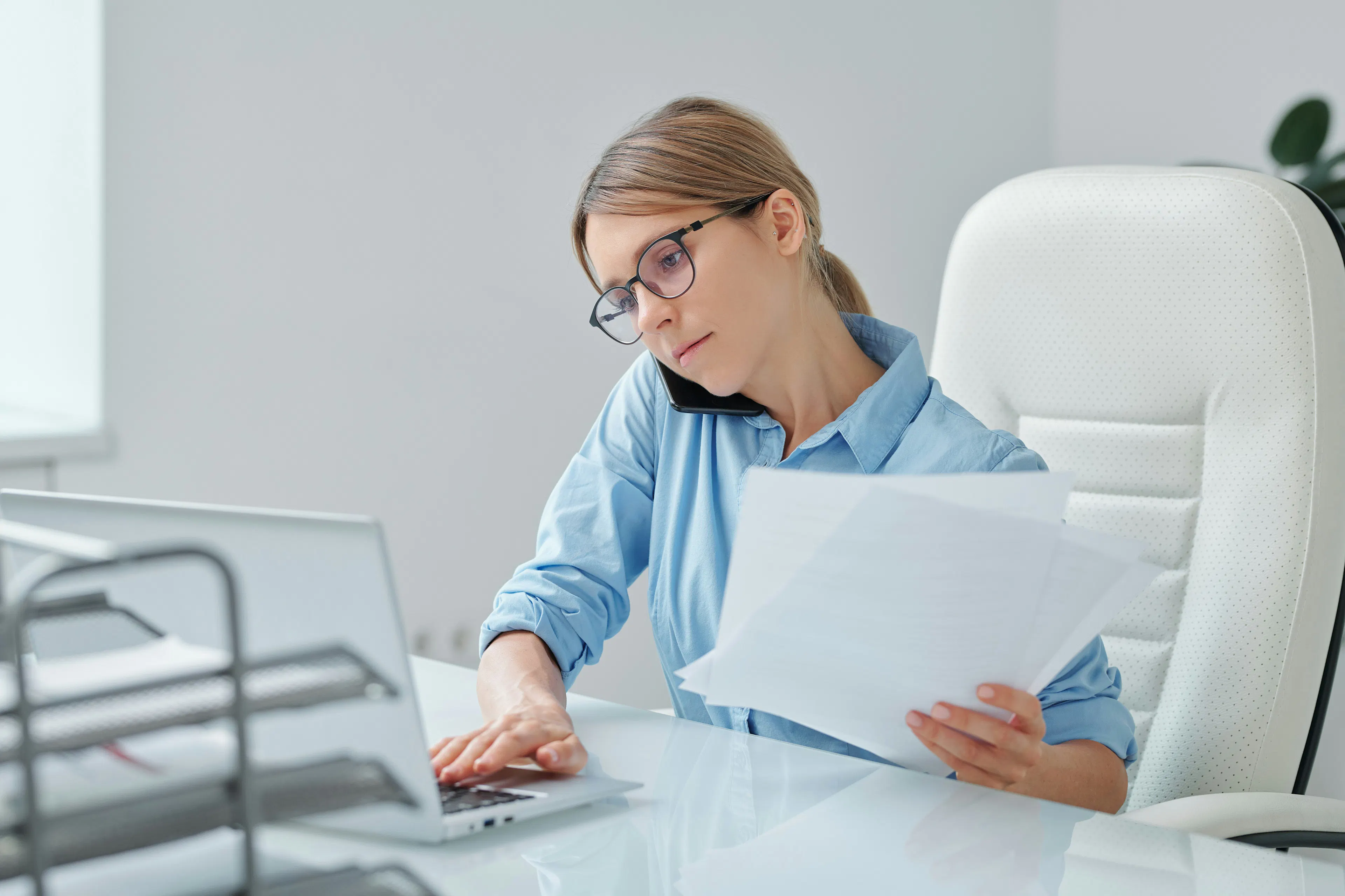 Woman reviewing documents at desk