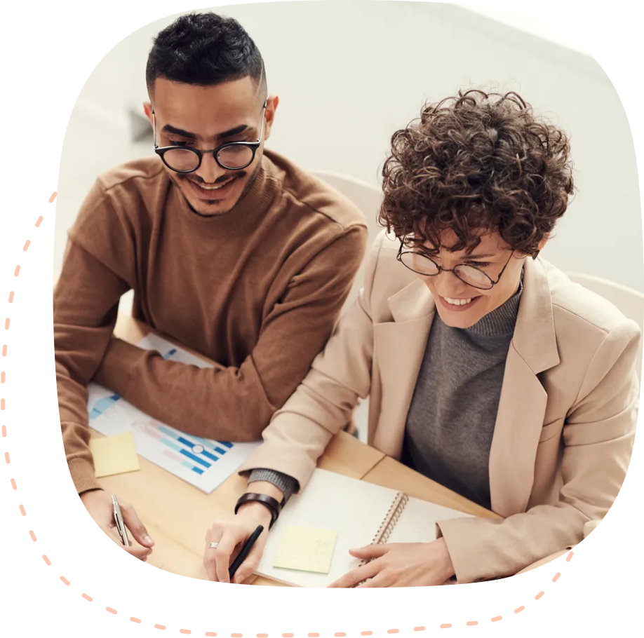 A man and a woman signing a document