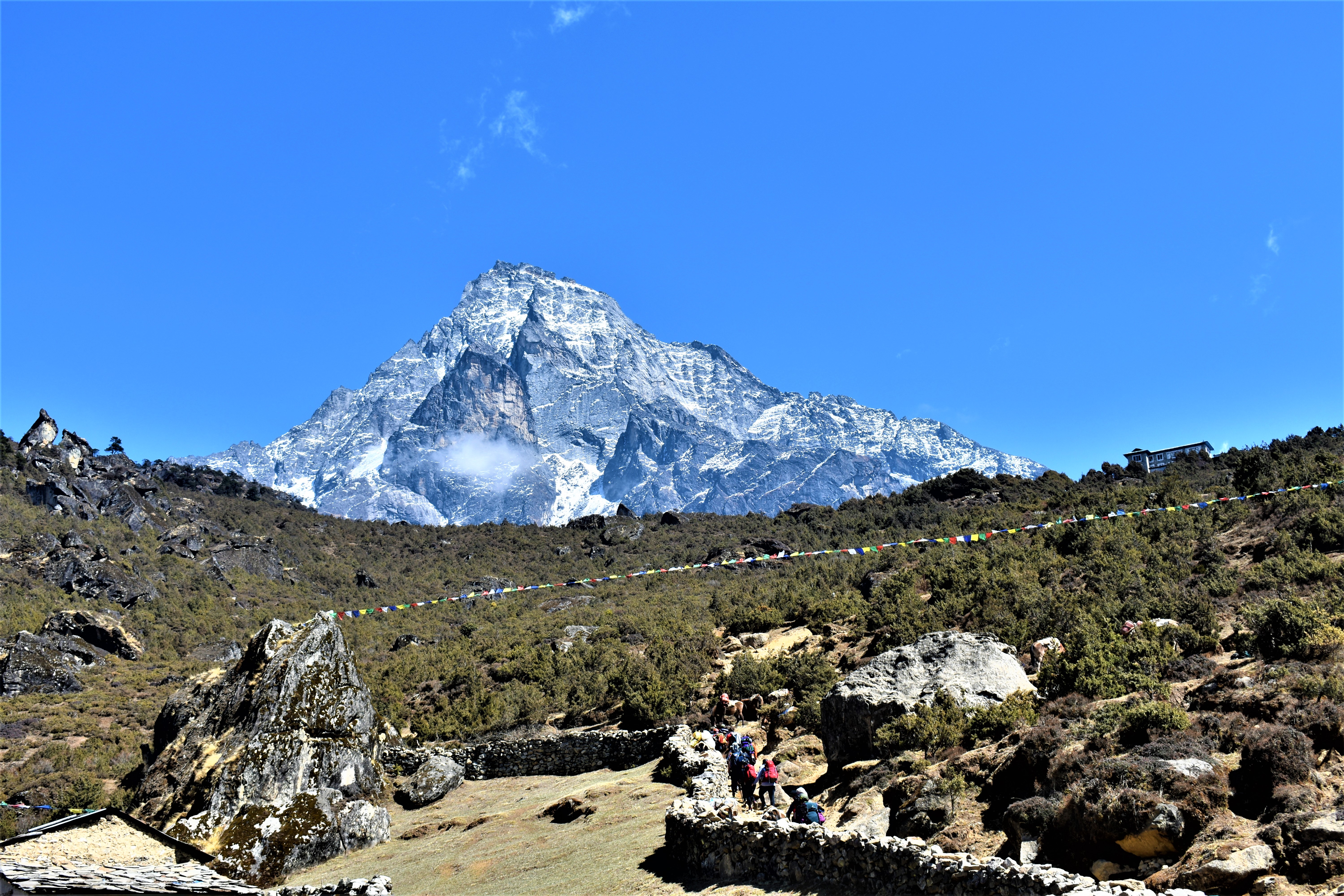 Scenery with a large mountain the background along the Everest Base Camp Trek.