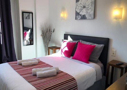 A bedroom at a French bed and breakfast hotel is shown with a double bed.