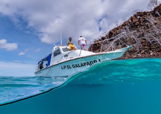 For the Dive & Stay scuba certification package, the scuba dive boat is show from the water.