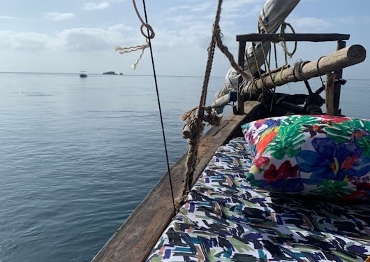 The front of a traditional dhow boat is shown in Kenya.