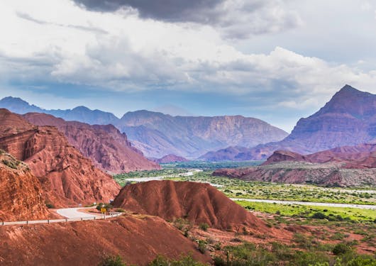 Red rock mountains are shown in Argentina.