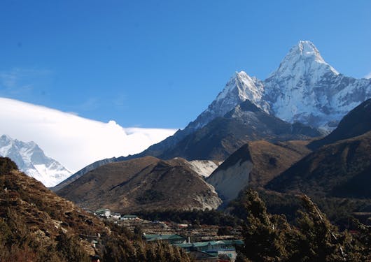 The Amadablam Base Camp trek passes through the town of Pang, with mountains in the background.