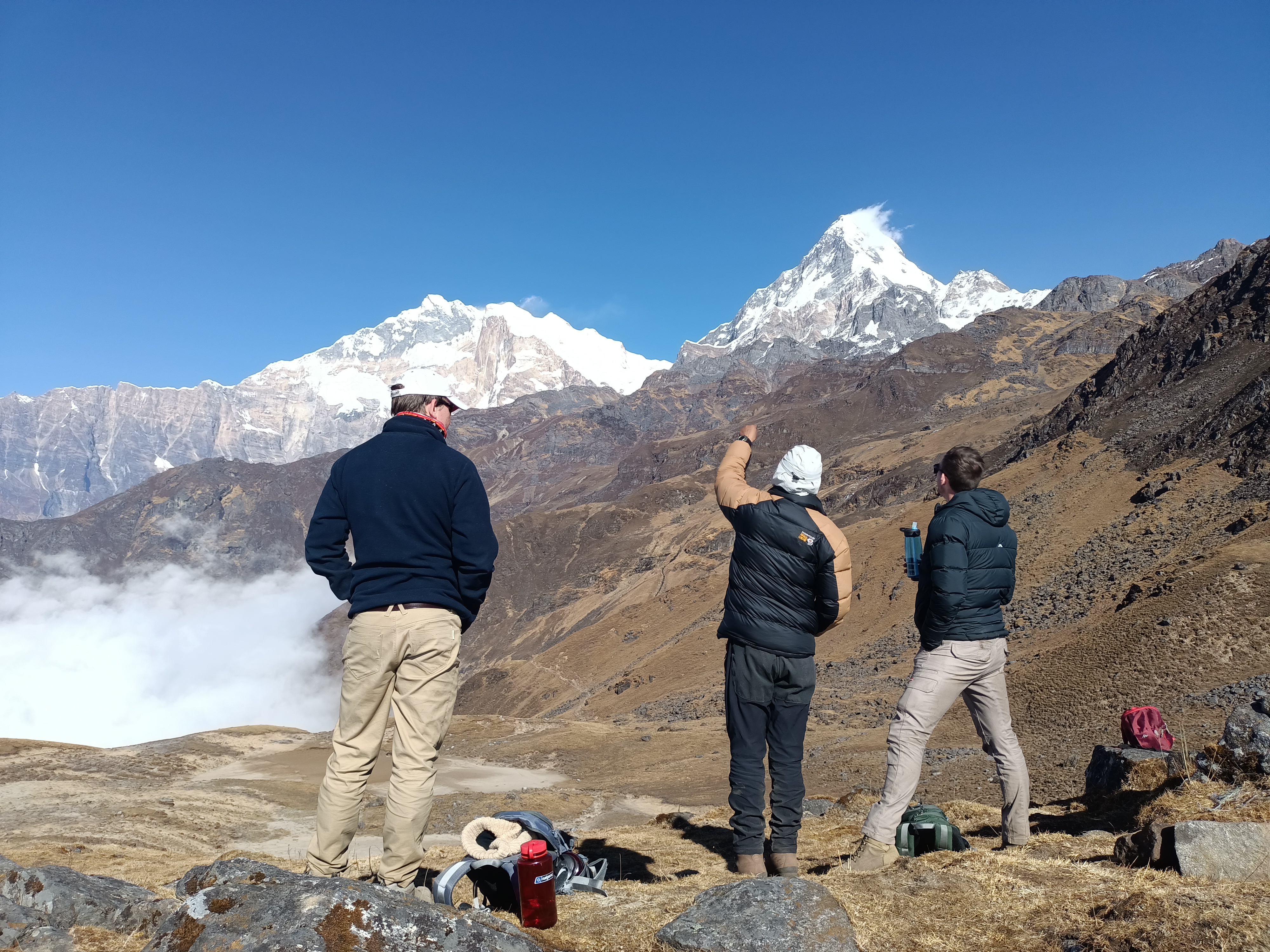 Trekkers pause to admire the mountains along the Khopra Ridge trail.