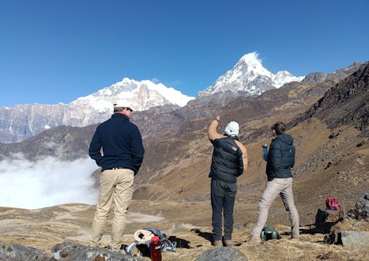 Trekkers pause to admire the mountains along the Khopra Ridge trail.