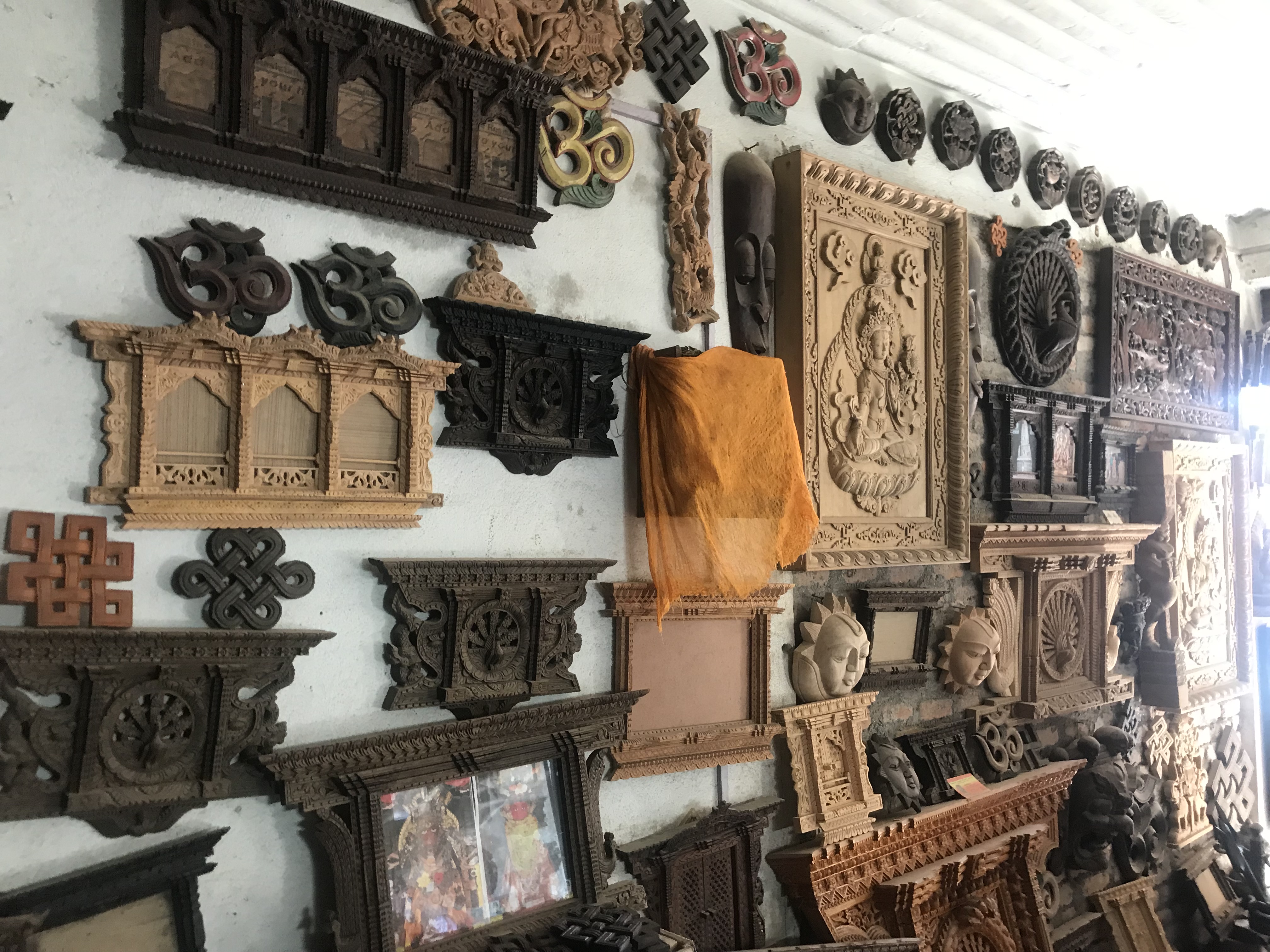 Finished wood pieces are shown in an artisan shop in Bungamati, India.