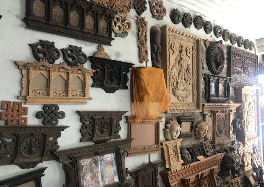 Finished wood pieces are shown in an artisan shop in Bungamati, India.