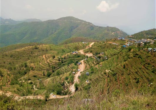 A path goes through the terraced fields of Ramkot village in India.