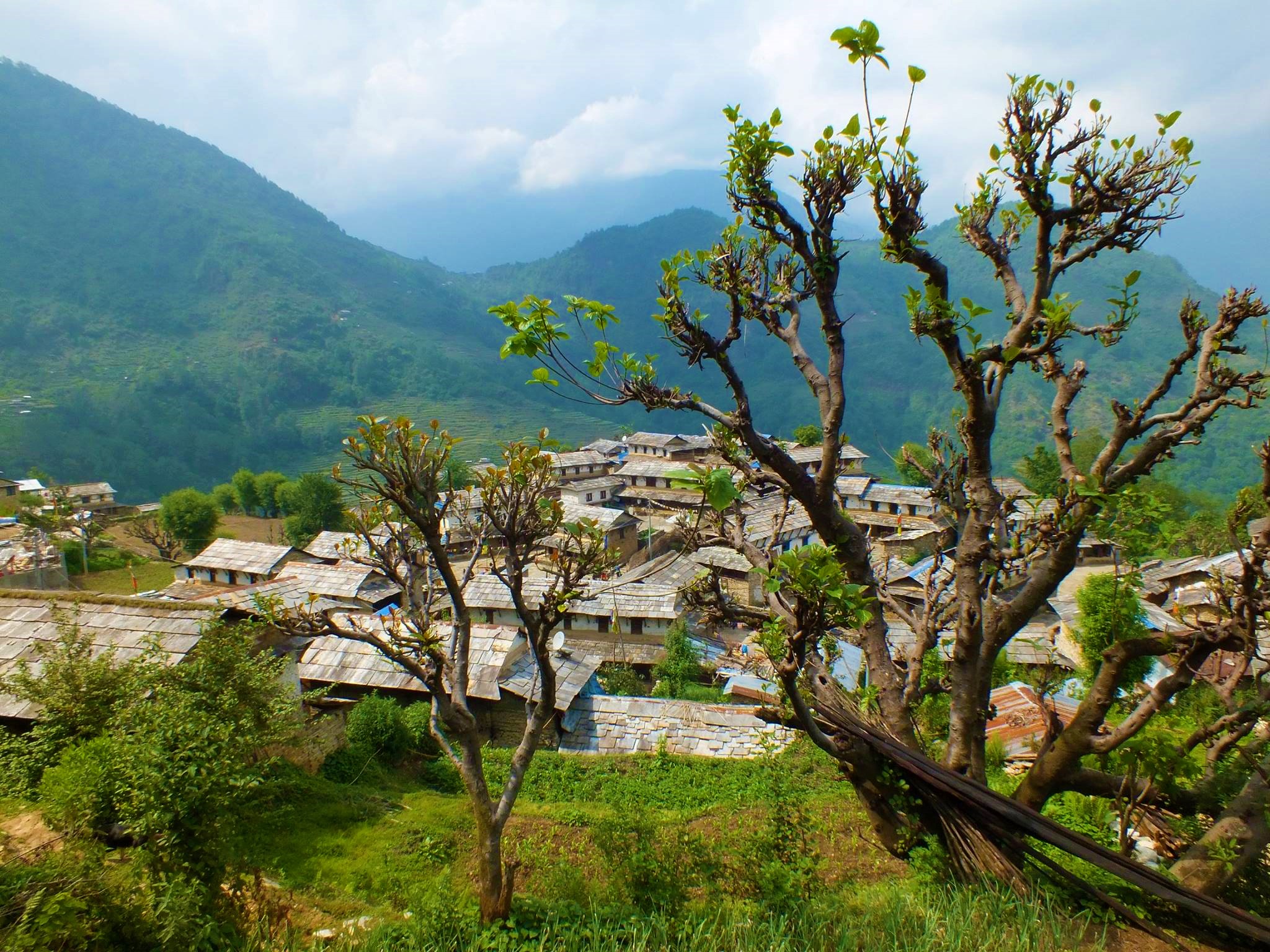 Ghandruk Village is shown from a distance on a clear day along the Annapurna Panorama Trek.