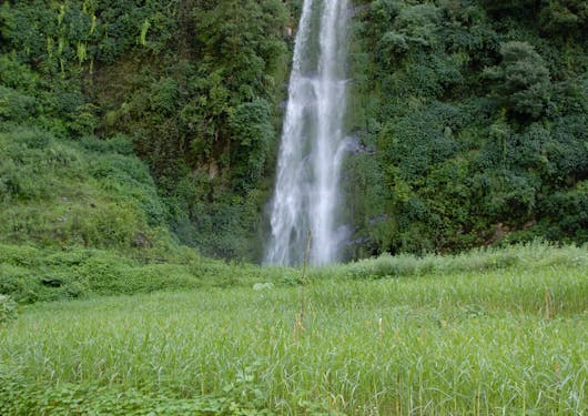 A waterfall is shown on the way to Landruk along the Annapurna Panorama Trek.