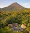 Arenal Volcano in Costa Rica is shown in the distance beyond the Manoa Hot Springs.