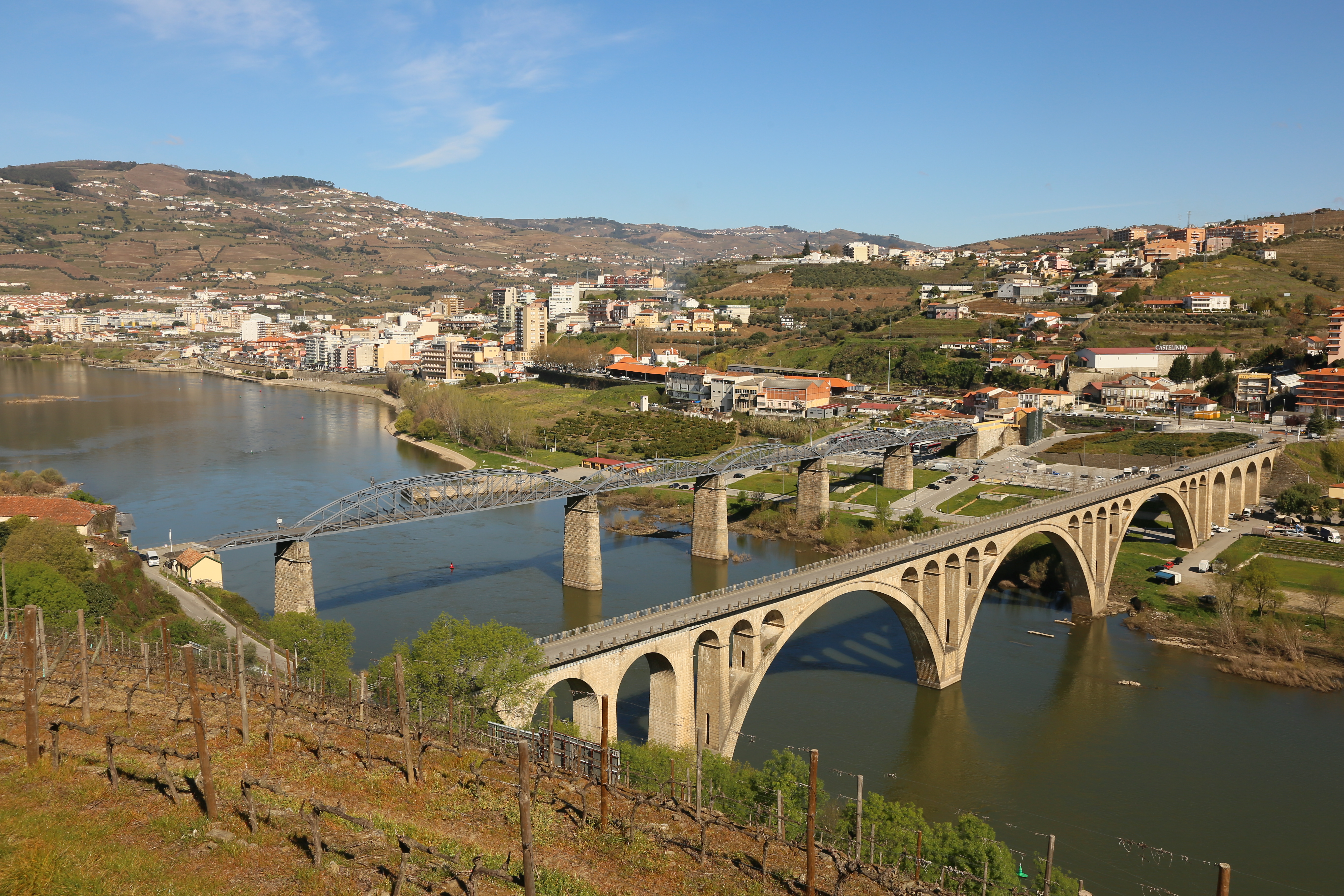 Two parallel bridges cross Portugal's Douro River into a nearby town.