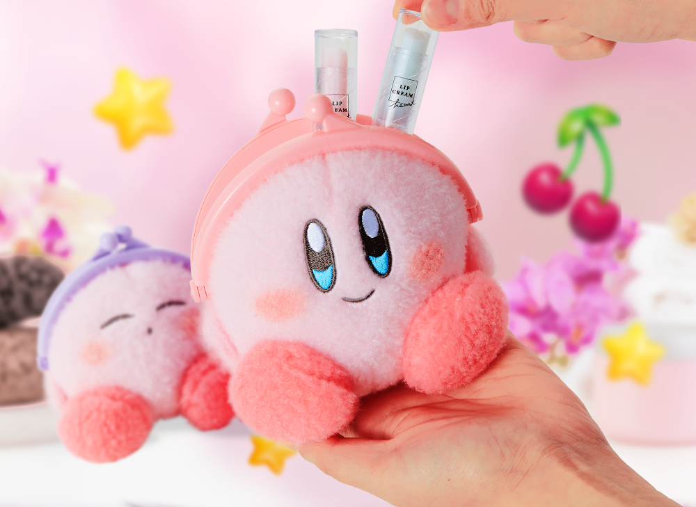 A hand holding a smiling kirby puffy pouch and putting chapstick into the pouch