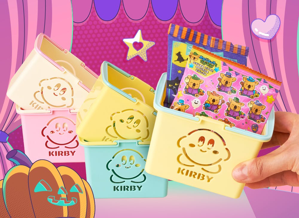 A hand holding a yellow Kirby basket with treats inside the basket with four other Kirby Mini Baskets are in the background
