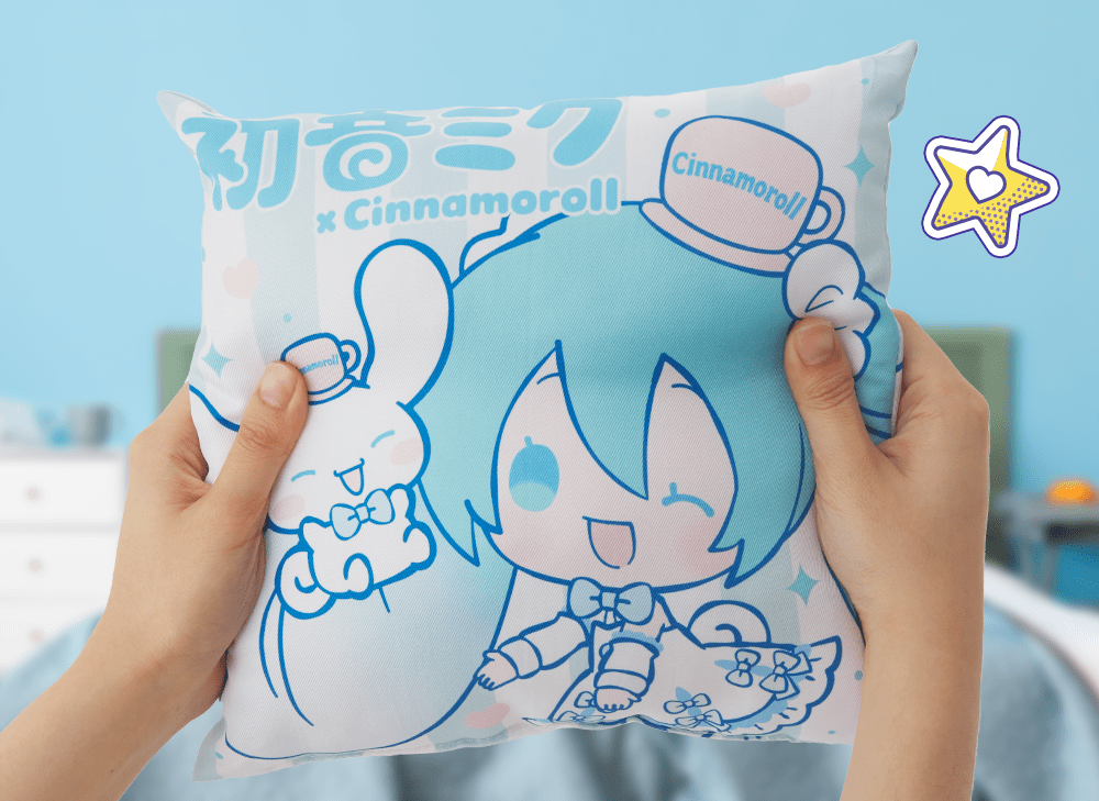 A picture of hands holding a square cushion pillow with Hatsune Miku dressed as Sanrio's Cinnamoroll next to Cinnamoroll