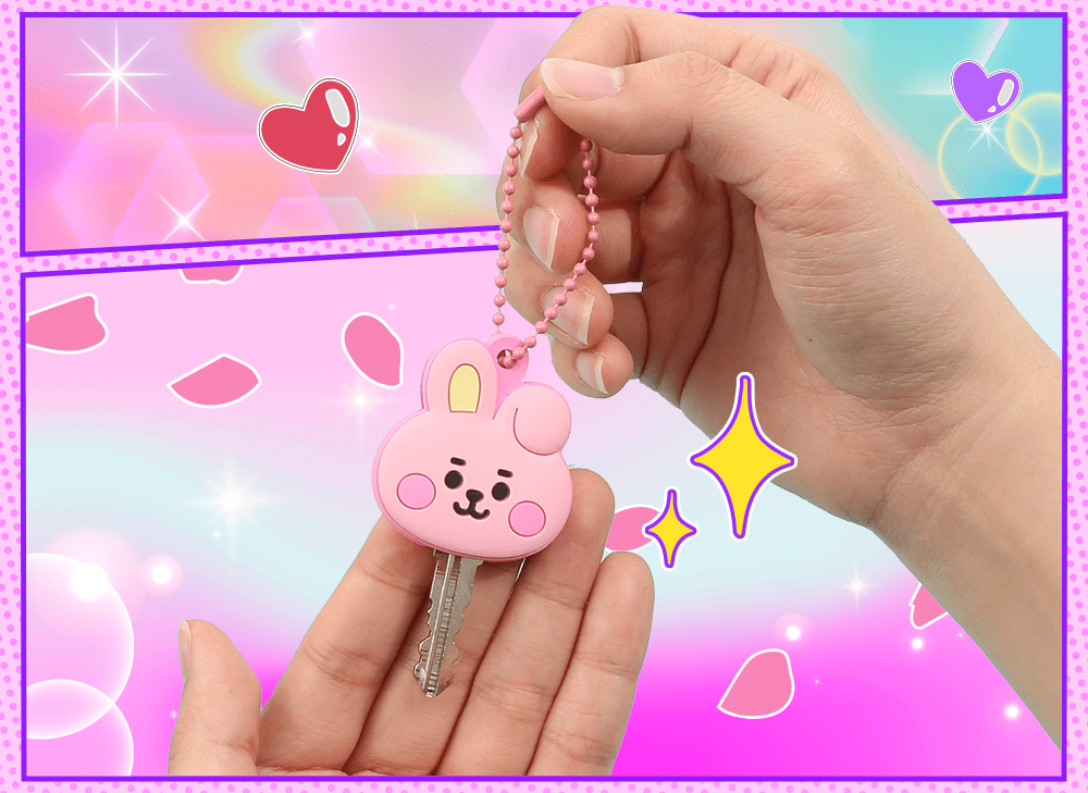 A hand holding a key inside of the BT21 Key cover item found in the YumeTwins Valentine's Love Story Box