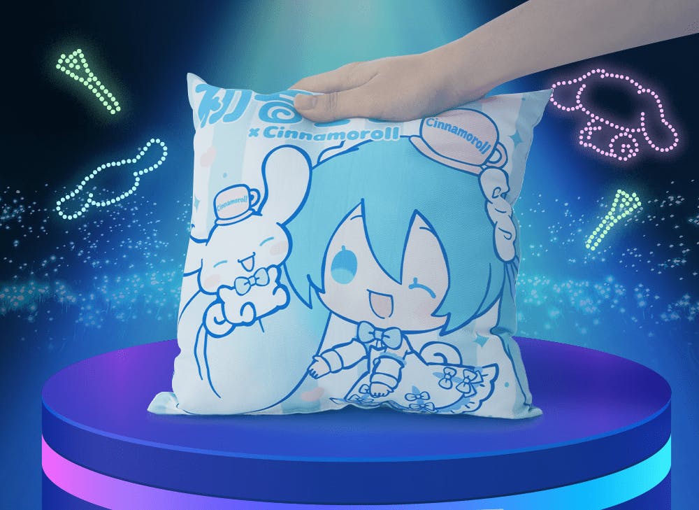 A picture of a hand on a Hatsune Miku and Cinnamoroll cushion in front of a dark background with colorful neon lights. 