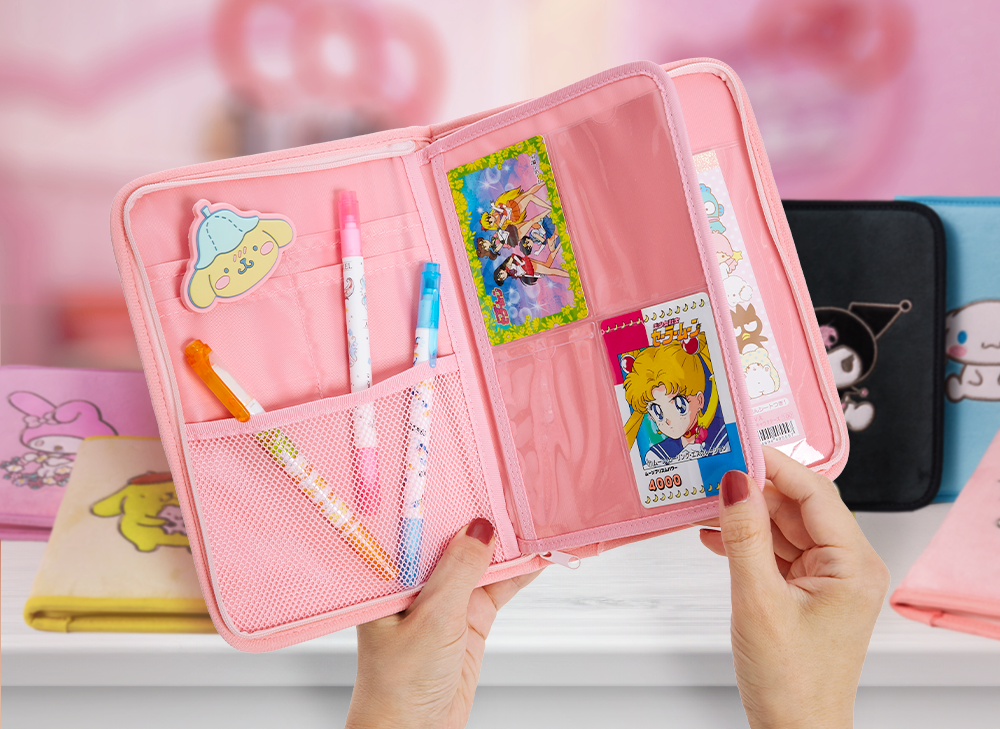 Person holding open a Sanrio Case with kawaii goodies inside