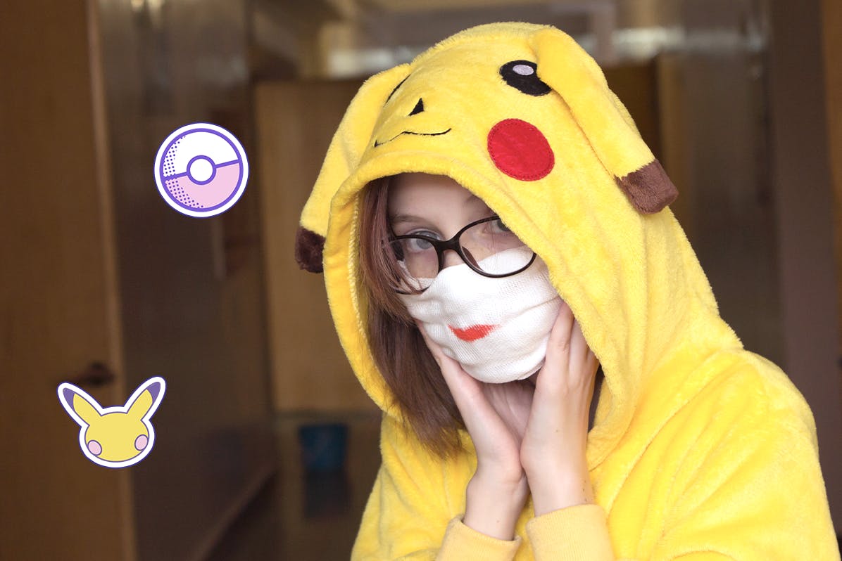 A girl wears a cozy Pikachu kigurumi costume.