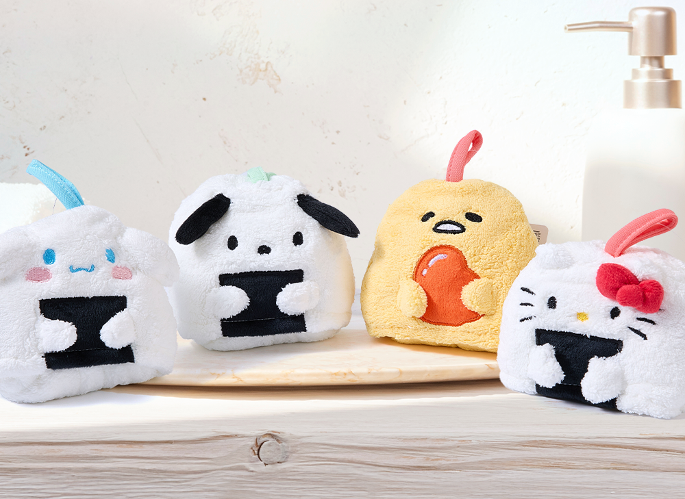 Sanrio Onigiri Hand Towel sits on a kawaii bathroom sink background.