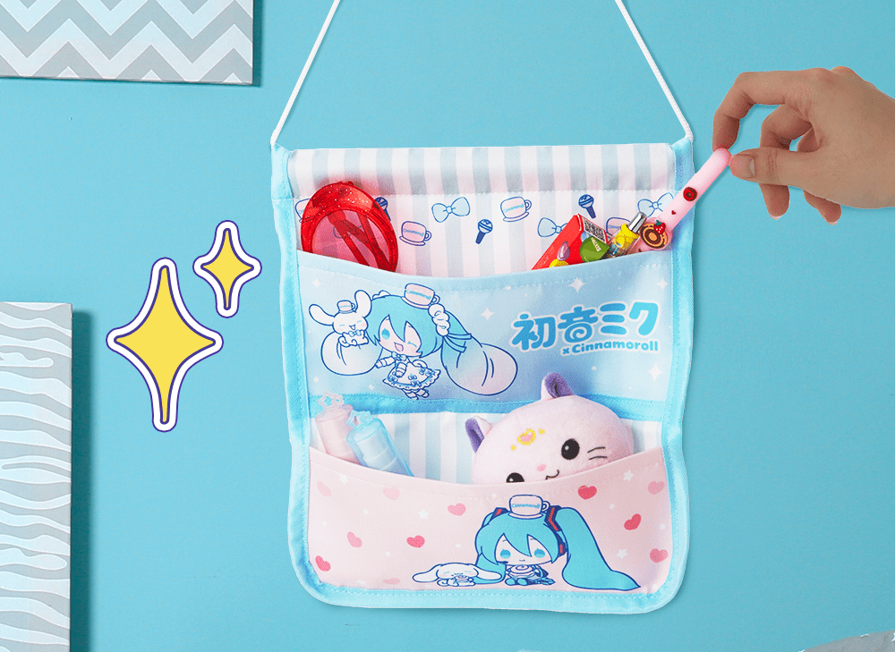 A picture of a Hatsune Miku and Cinnamoroll hanging wall organizer with a hand putting items in the top pocket. 