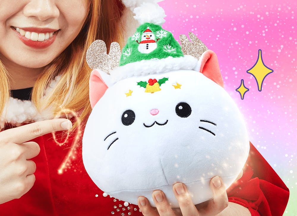 Yumetwins mascot magical nyan nyan is white with a santa hat and antlers as a Christmas themed plushie toy.