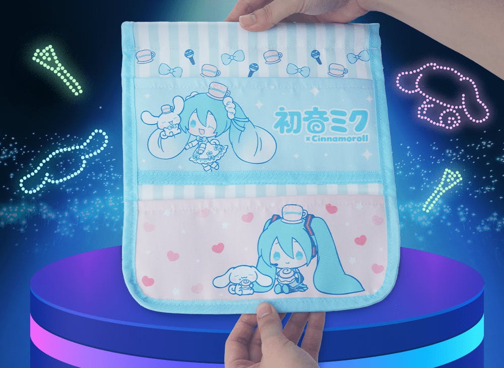 A picture of hands holding a Hatsune Miku and Cinnamoroll hanging organizer in front of a dark background with colorful neon lights.