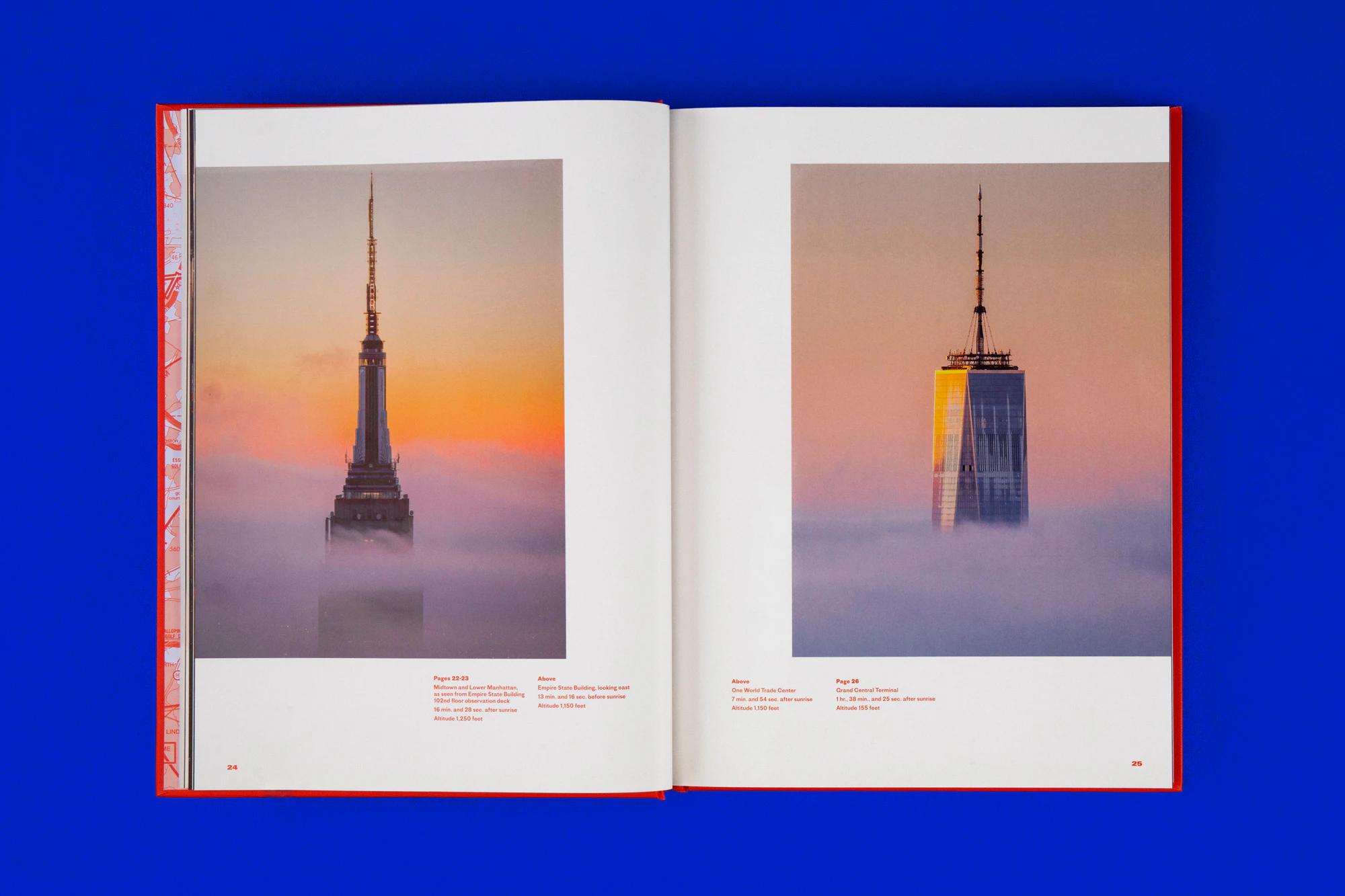 Overhead photo of the book showing a double spread each with a sunrise photo of a skyrise. The sunrise is showing lavender, orange, yellow, and pink colors and the sky risers are gray metal. The book is lying on a cobalt blue seamless.